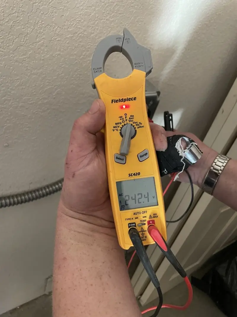 Voltage testing with clamp meter during Hot Tub / Pool Electrical Wiring in Perry